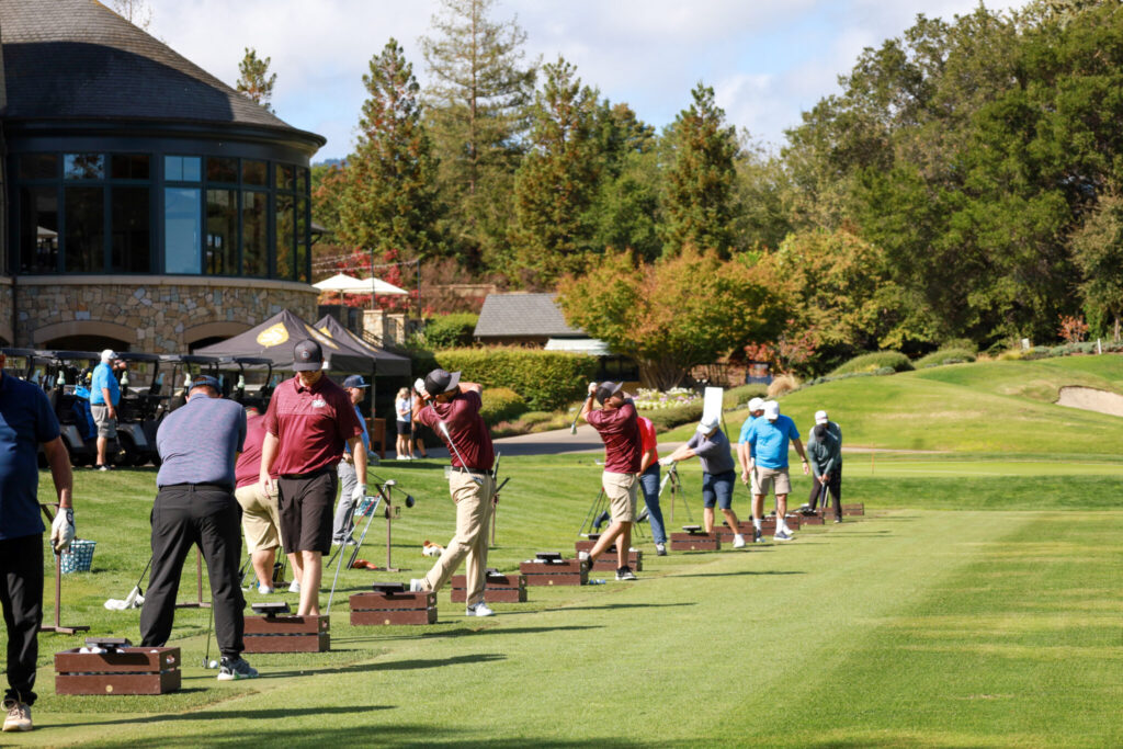 Several people golfing