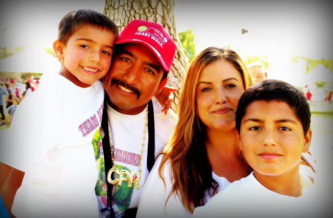 The Medina-Flores family. Alex and his older sibling, alongside mom & dad.