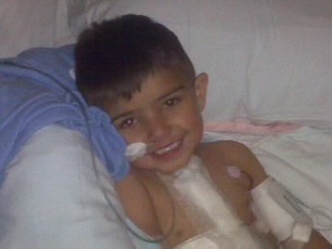 A child smiling with medical equipment