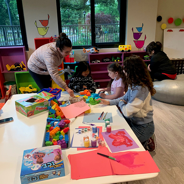 Activity Room Play Activity Room Play: Two Activity Room Volunteers playing with children.