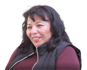 Woman with long dark hair smiling, wearing a maroon top and black quilted vest