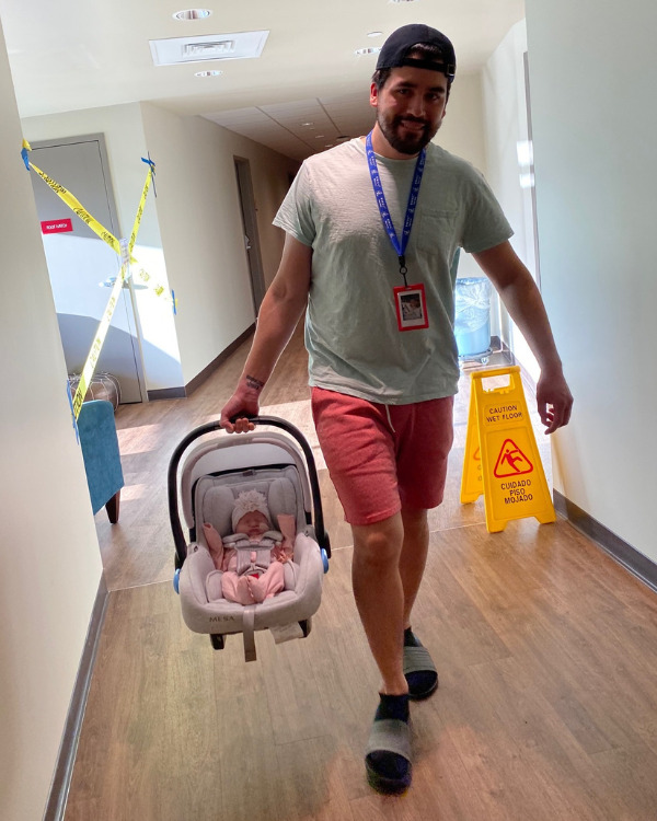 Dad carrying baby