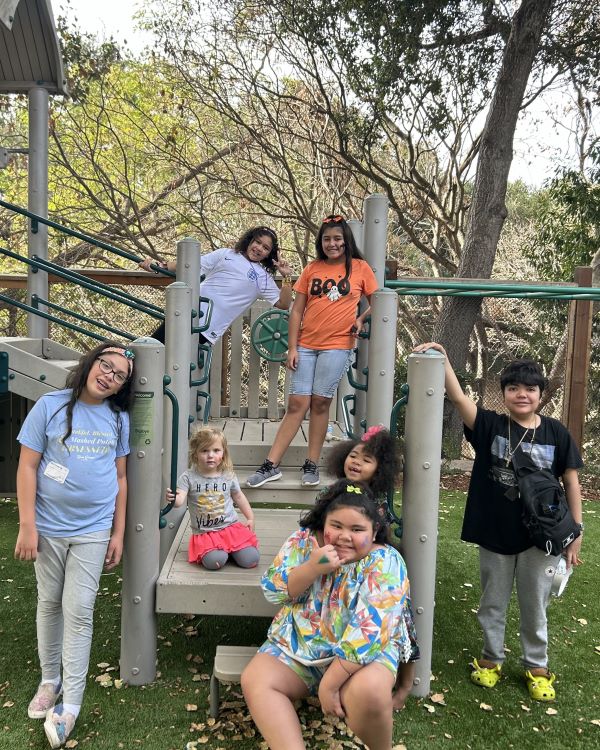 A group picture of children at a playground.