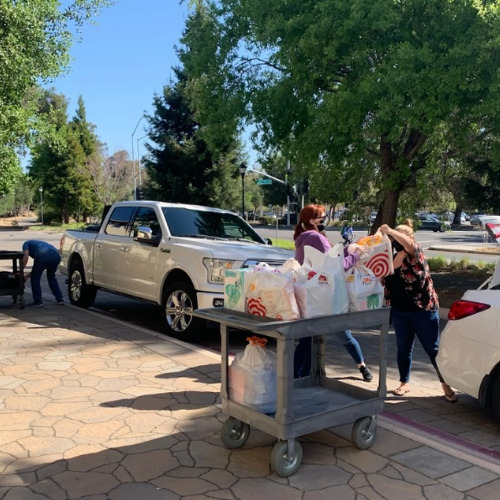 Izzy's family dropping off donations in memory of her birthday.