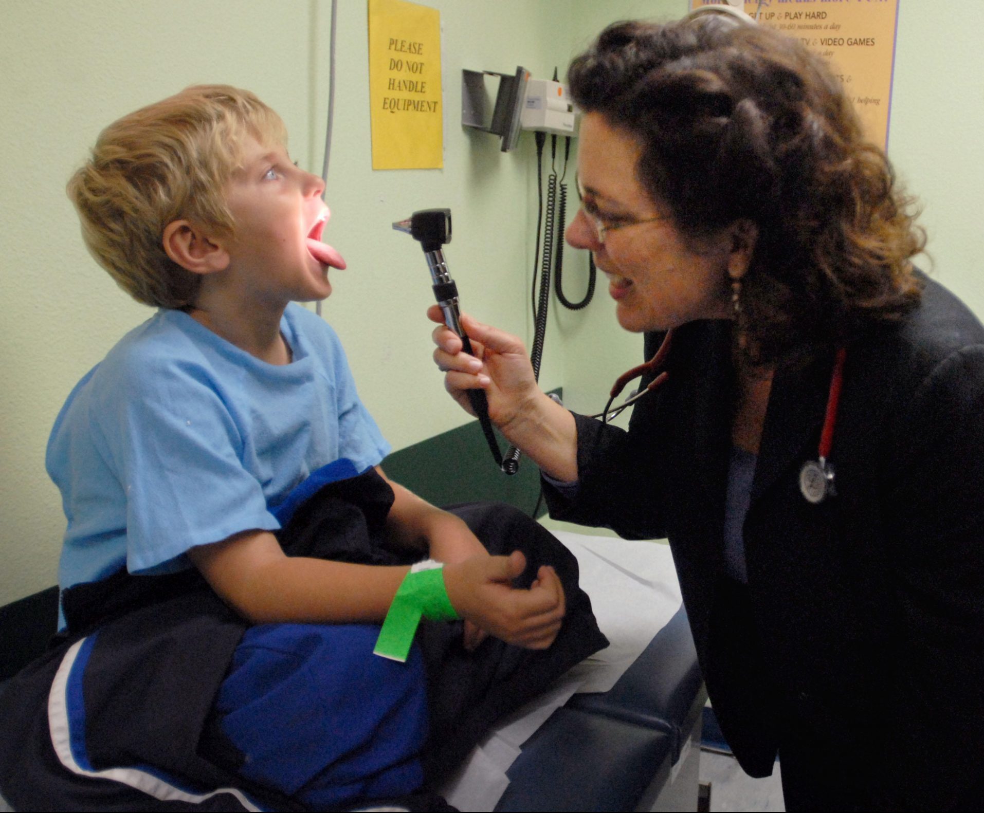 Kelley Meade, MD, with a pediatric patient