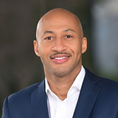 Man in blazer smiling