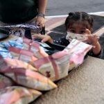 Silbing at Oakland Children's reaches for snacks