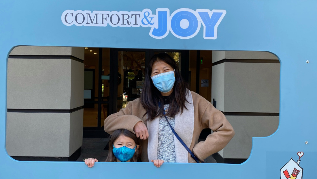Avery and her Mom donating to Comfort and Joy