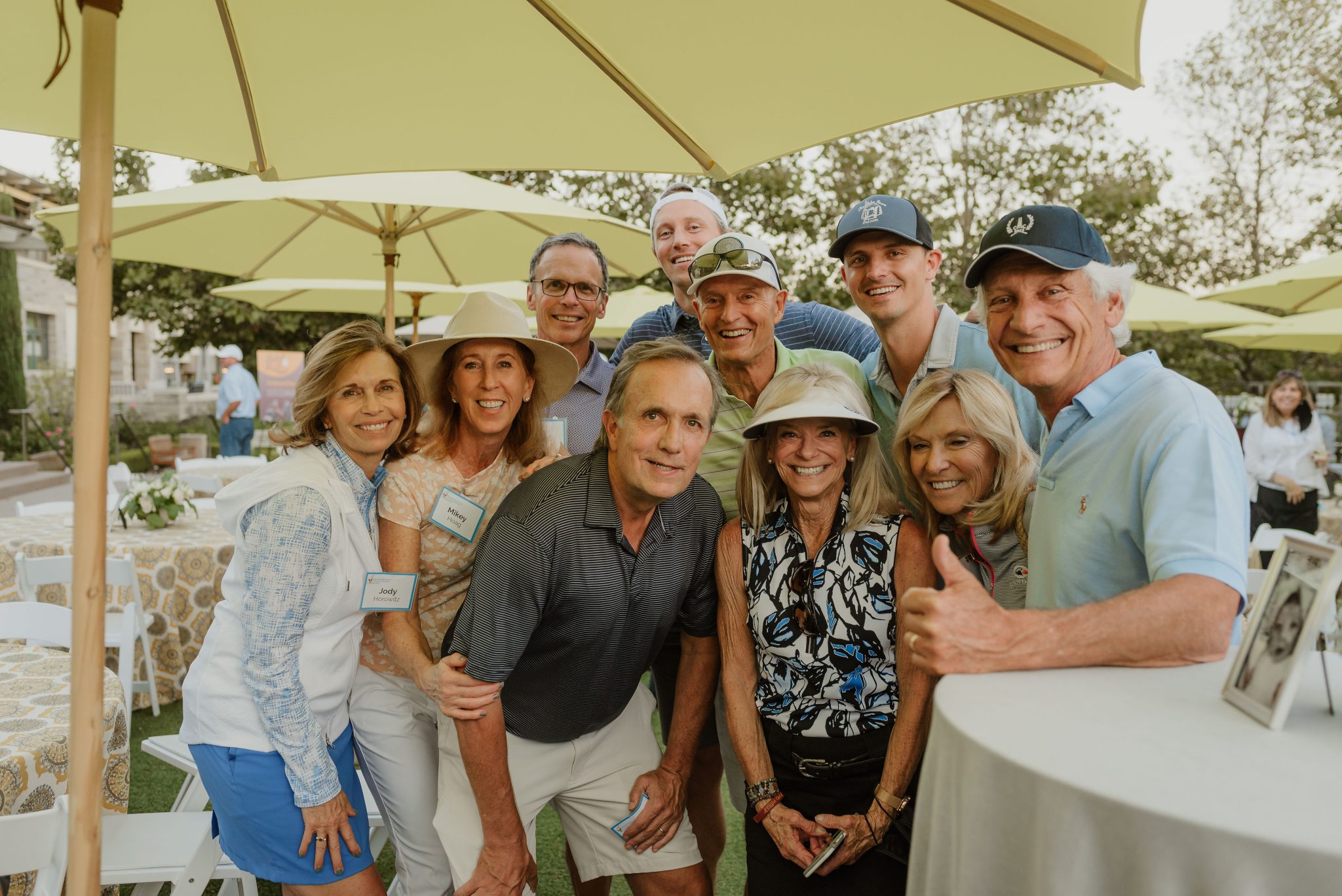 a group of donors including Brad are smiling at an event