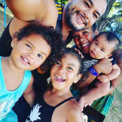 Kaiya Mack, Jonny Mack, Mariah Mack, Soka, Katana -- the Mack Family smiling in a selfie