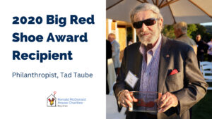 Philanthropist, Tad Taube. Philanthropist Tad Taube holding his Big Red Shoe Award at an outdoor RMHC Bay Area event.