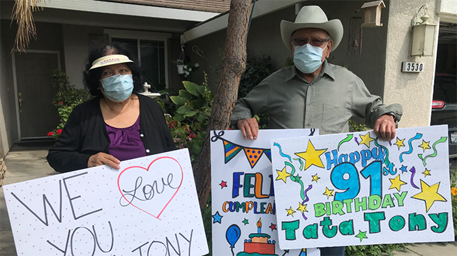 Supporters in masks holding signs